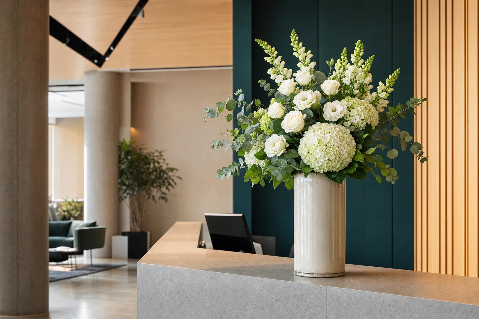 Large flower arrangement on an office reception desk