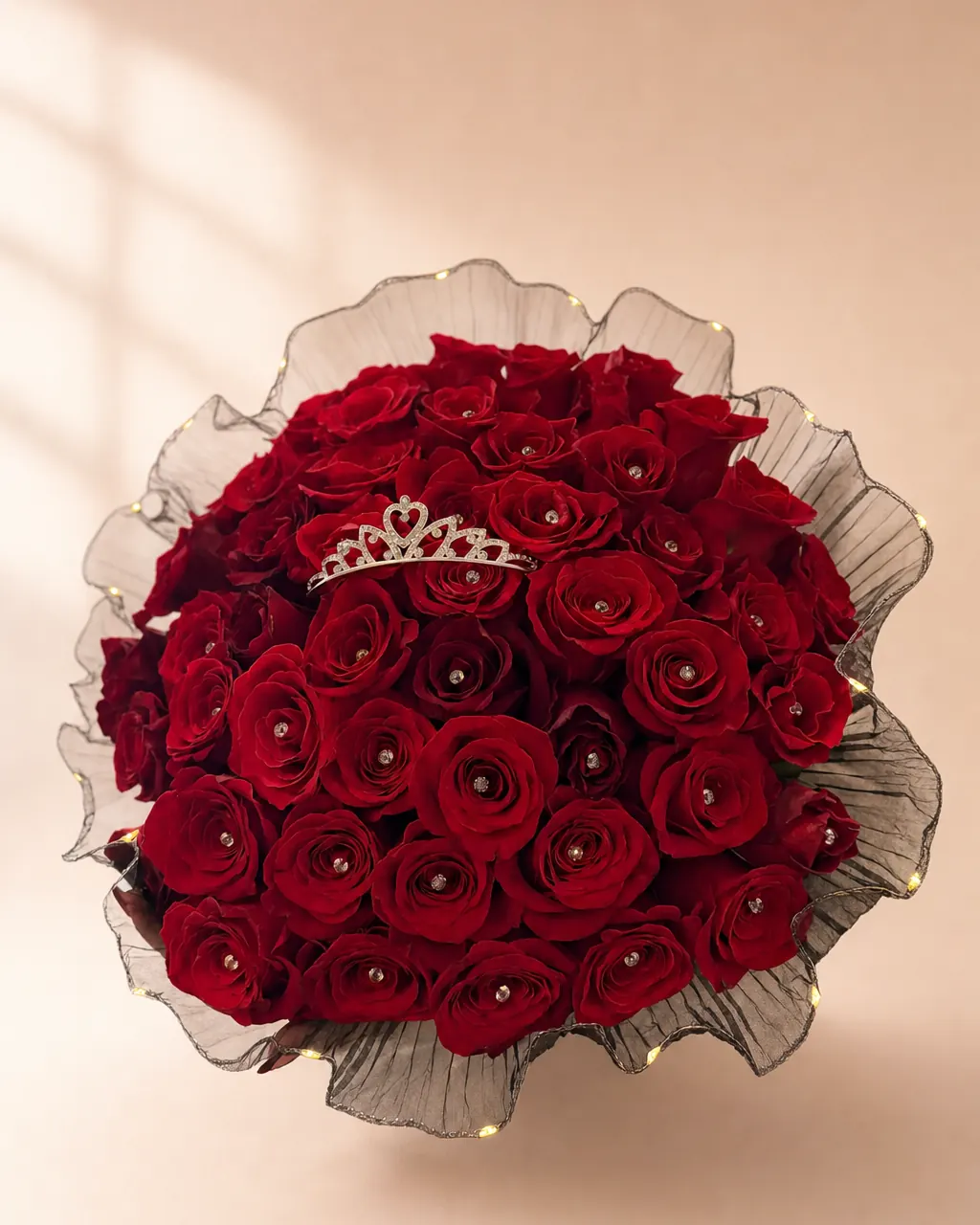 Coronation: 50 red roses with tiara, gem pins and LED mesh, photographed on a blush backdrop