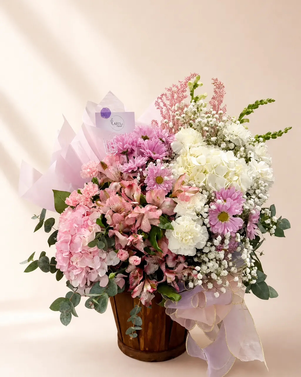 Garden Gate Basket: Hydrangeas, daisies and alstroemeria in a basket, photographed on a blush backdrop
