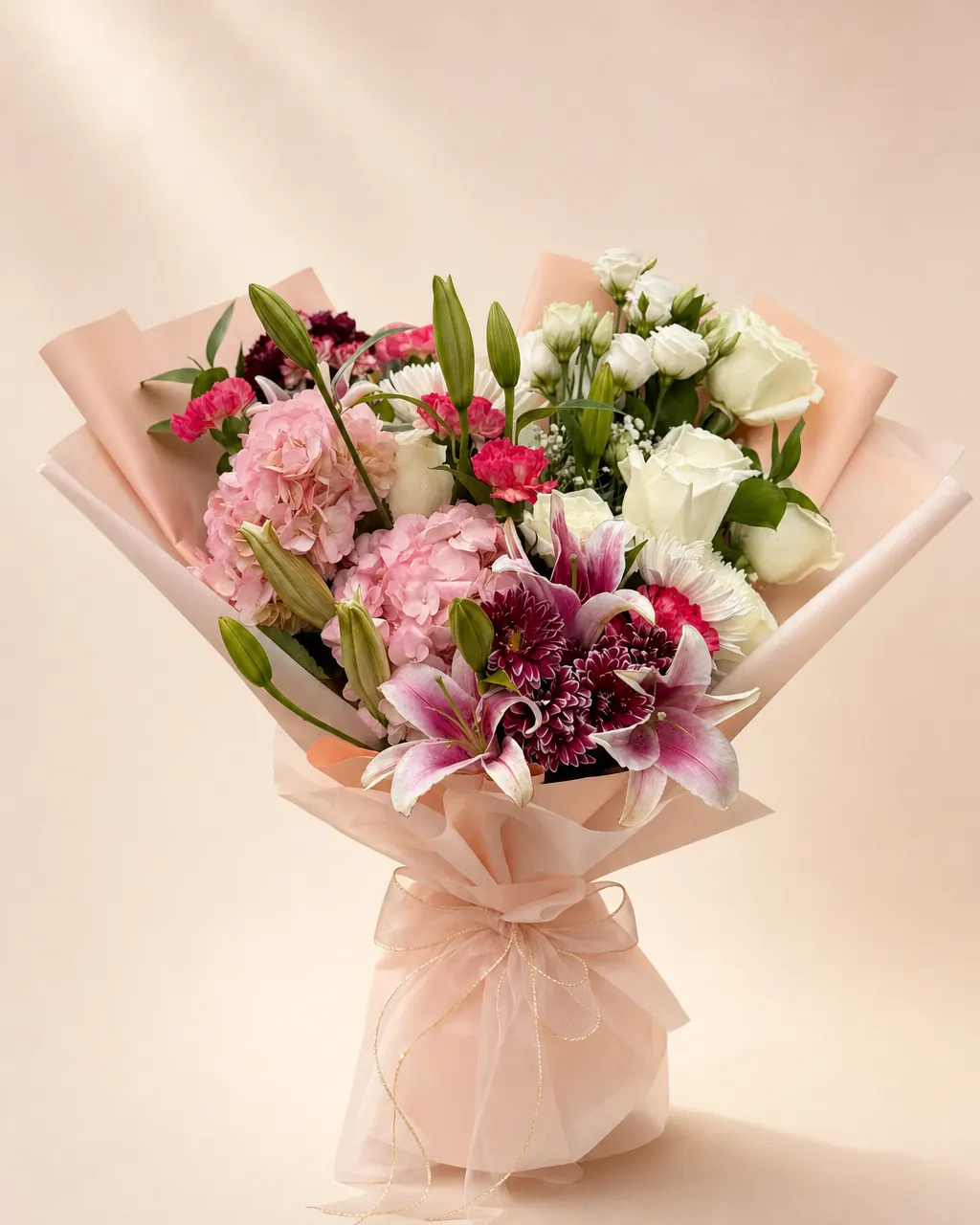Peach and Plum: Custom designed bouquet of mixed flowers, photographed on a blush backdrop