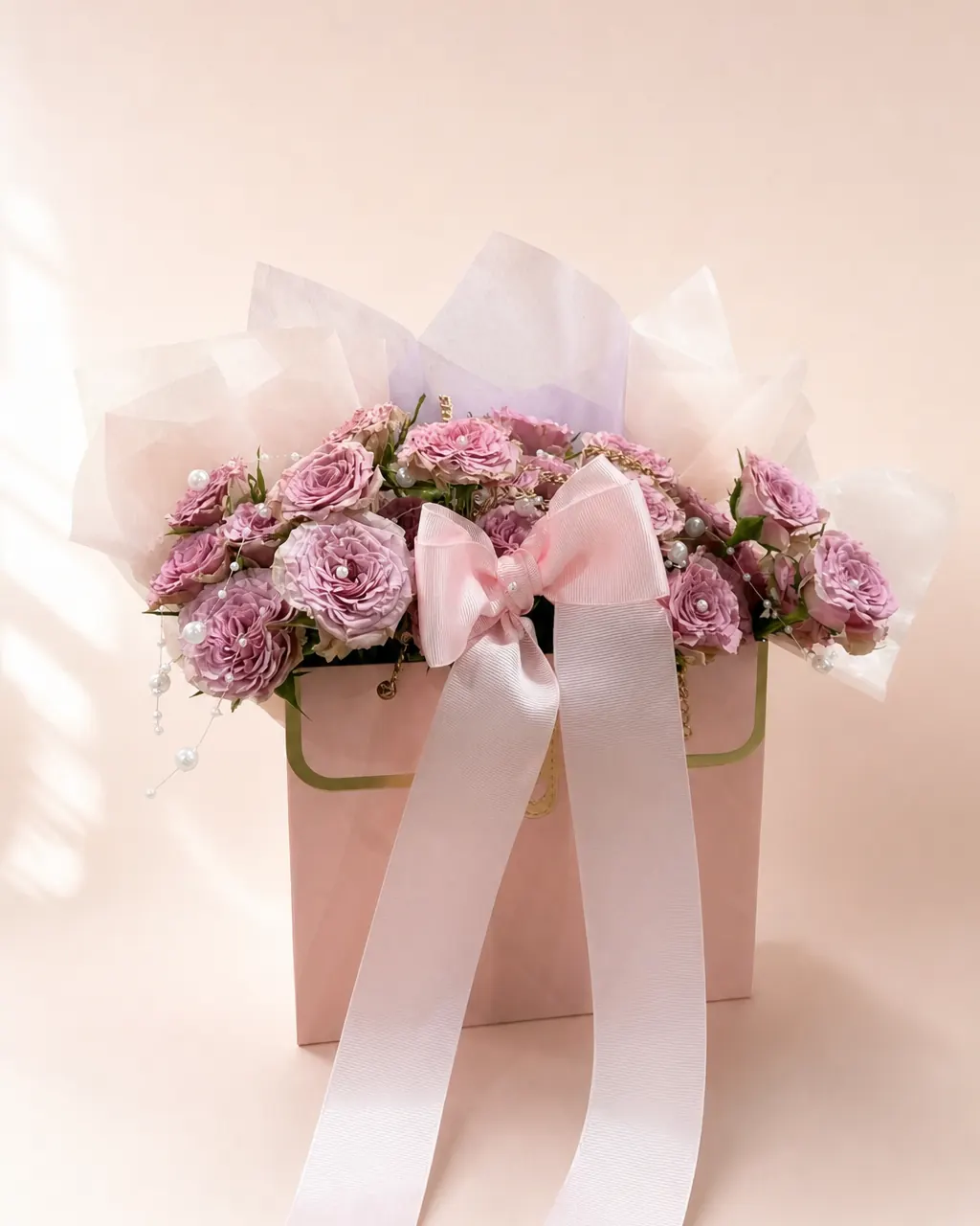 Petal Handbag: A purse full of seasonal mixed flowers, photographed on a blush backdrop