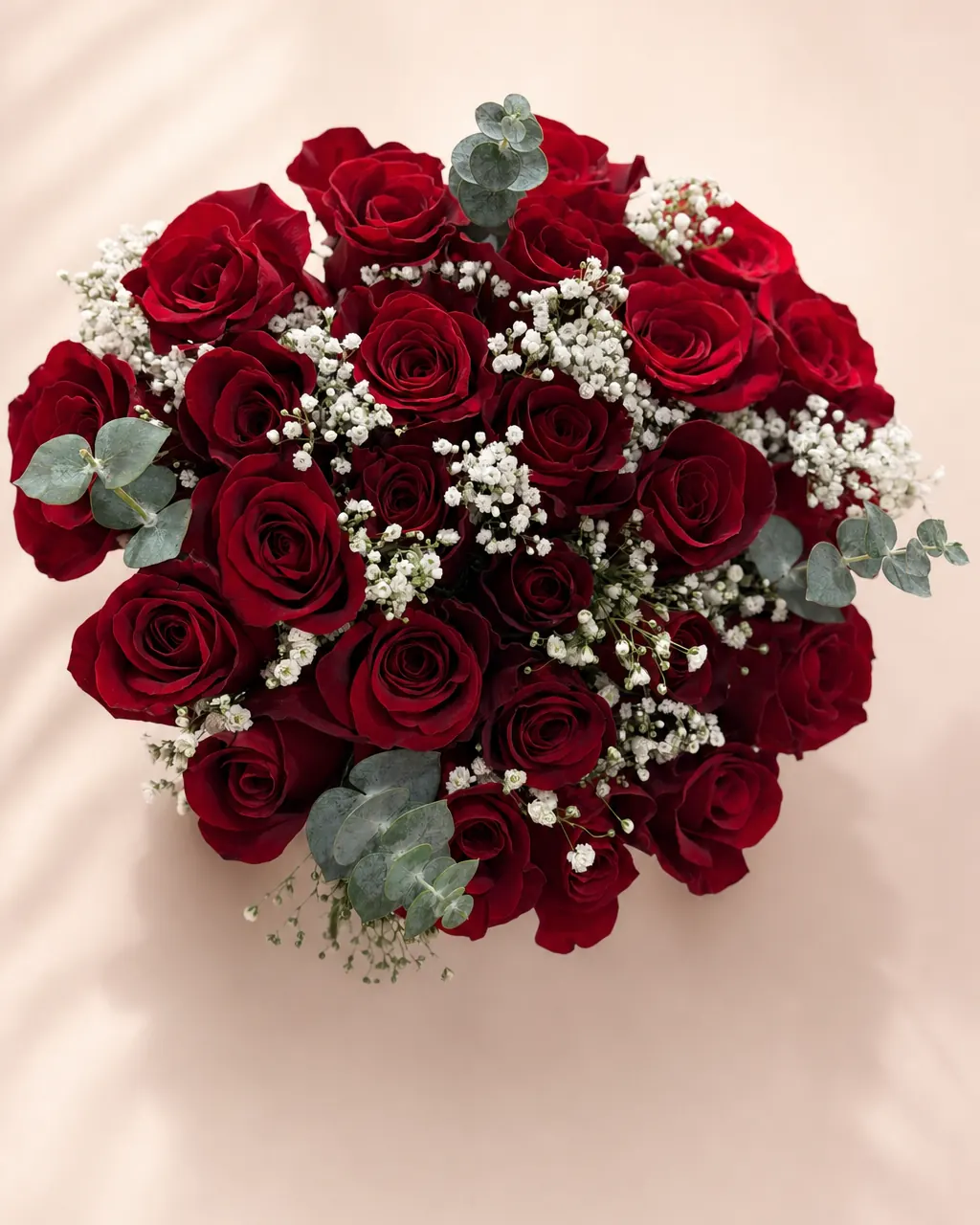 Red Promise: 25 premium red roses, bridal style with pearls, photographed on a blush backdrop