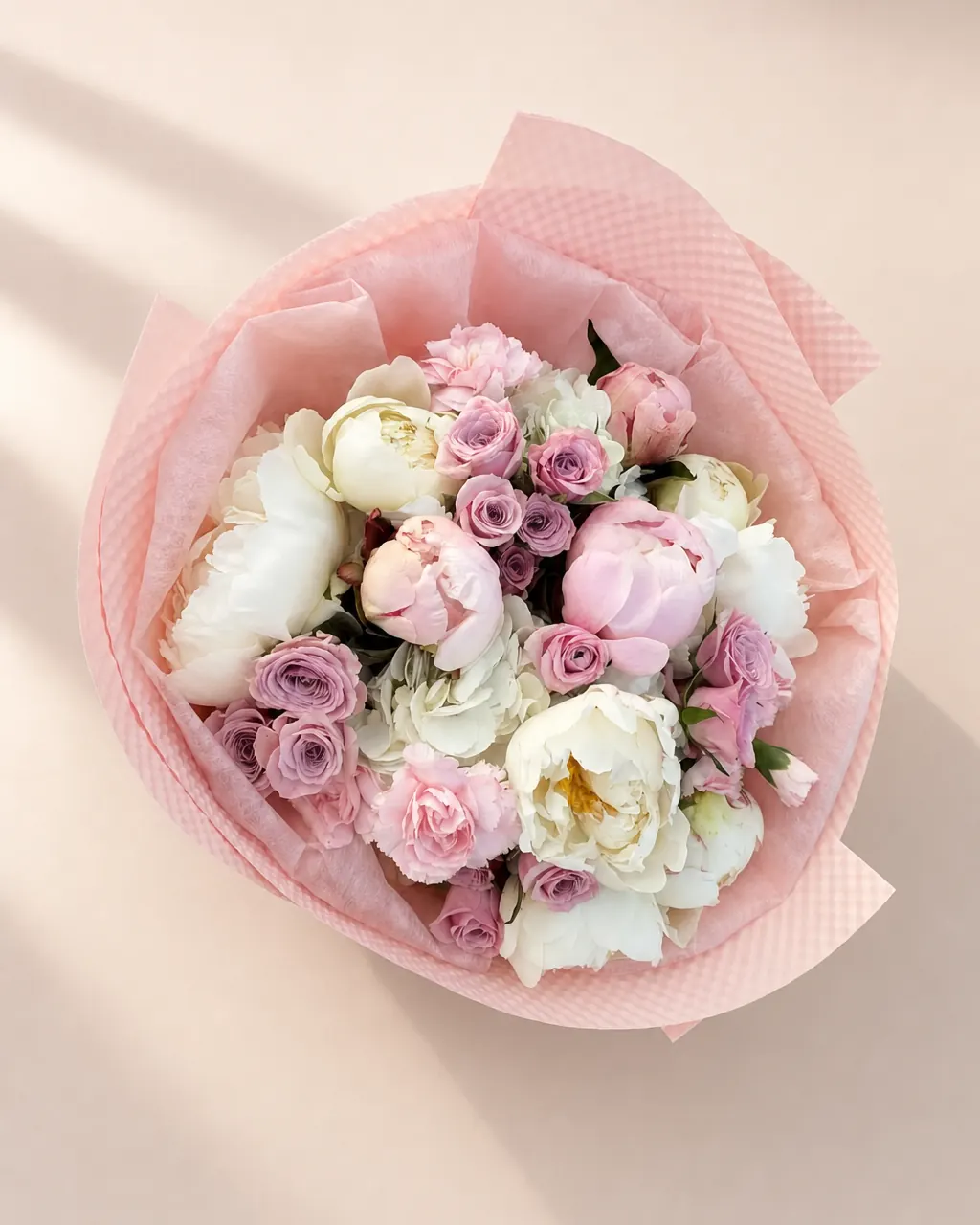 Rose Quartz: 10 peonies with hydrangeas and spray roses, photographed on a blush backdrop