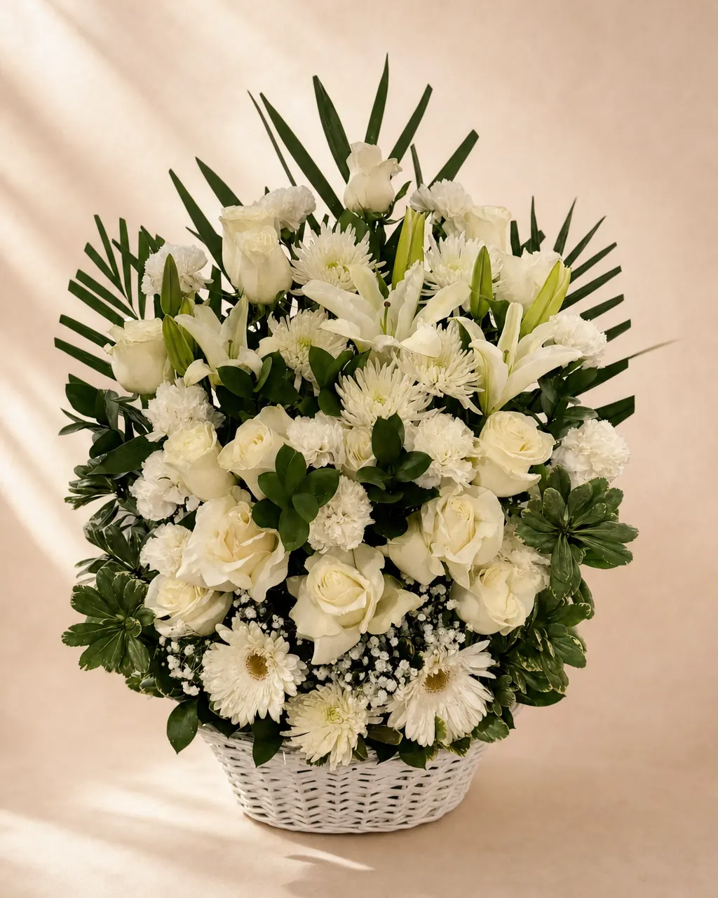 White Vigil: Large white arrangement of roses, lilies and mums, photographed on a blush backdrop